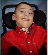 Child with a Tracheostomy in a wheelchair